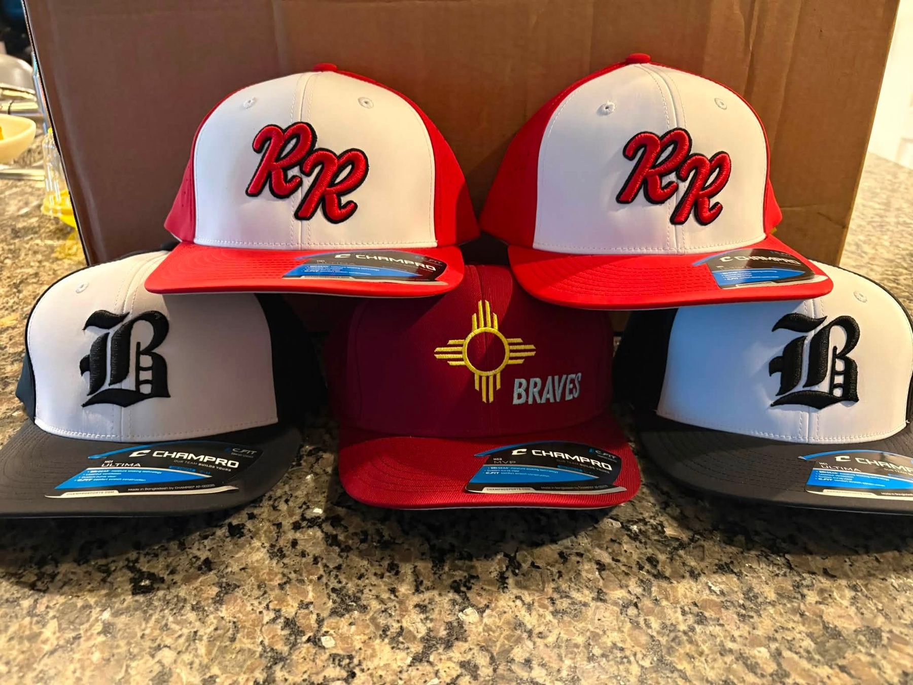 Custom embroidered team hats by Signature Styles